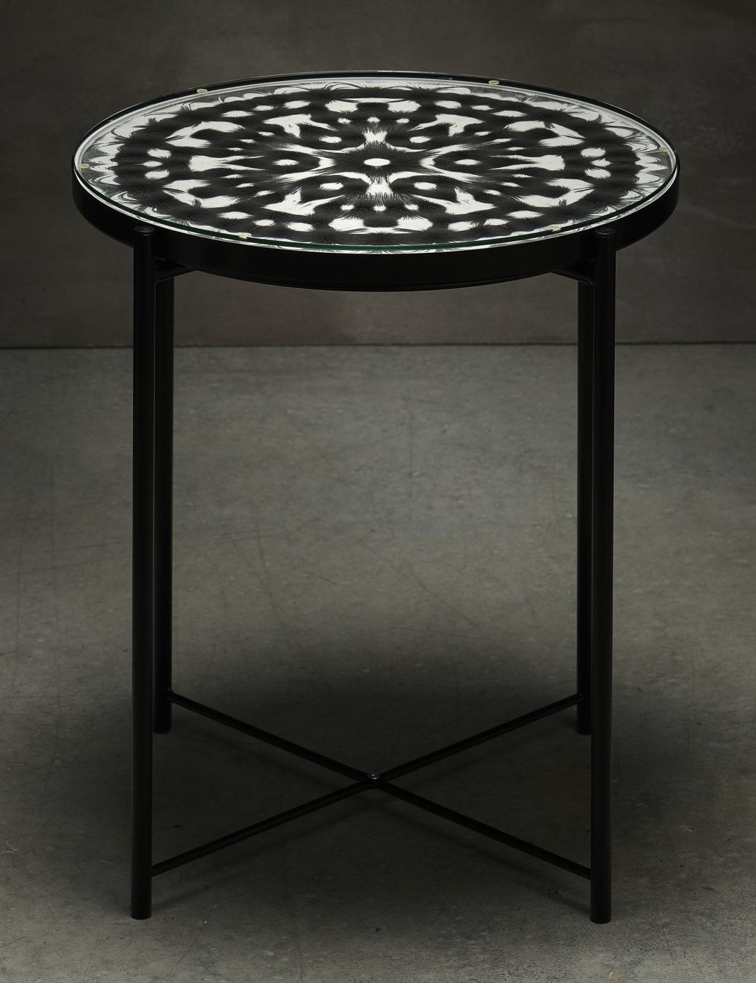 Magnetic field mandala set into the top of a round side table